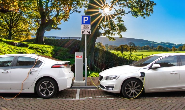 2 Electric Cars At Charging Station